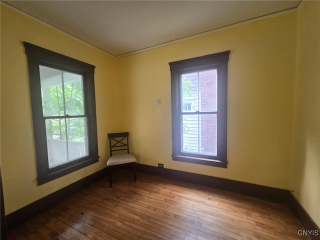 826 Lancaster Ave, Syracuse, NY 13210 - empty room with hardwood / wood-style flooring and crown molding
