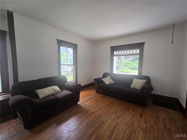 826 Lancaster Ave, Syracuse, NY 13210 - living area with healthy amount of natural light and hardwood / wood-style flooring
