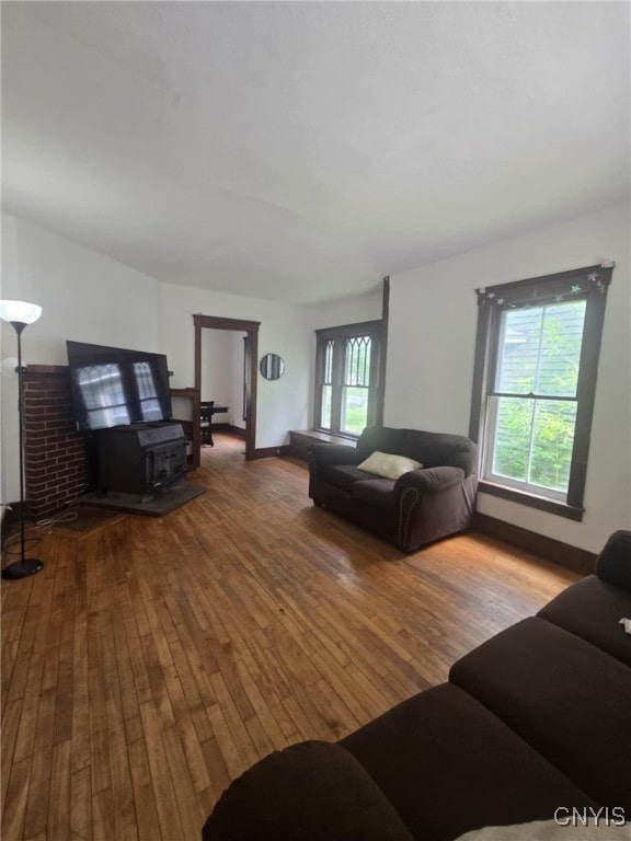 826 Lancaster Ave, Syracuse, NY 13210 - living area with a wood stove and hardwood / wood-style floors