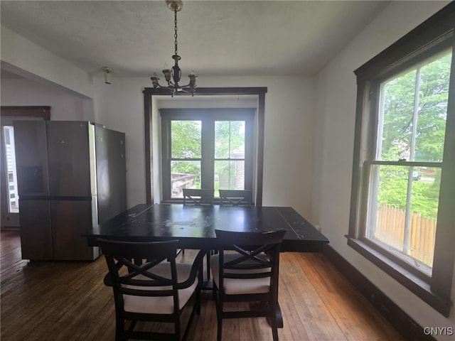 826 Lancaster Ave, Syracuse, NY 13210 - dining space with a chandelier and dark wood-type flooring
