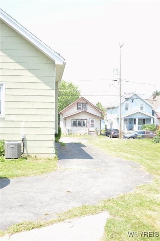 77 Harlem Rd, West Seneca, NY 14224 - view of asphalt driveway featuring a residential view