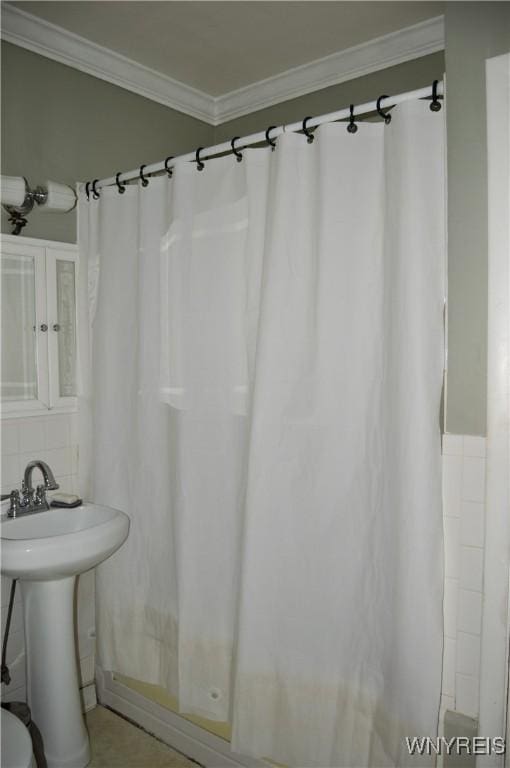 77 Harlem Rd, West Seneca, NY 14224 - bathroom with crown molding, tile walls, and shower / tub combo with curtain