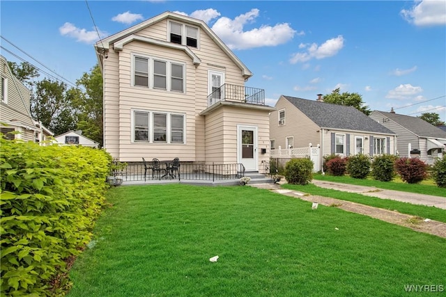 153 Hinman Ave, Buffalo, NY 14216 - back of property featuring a balcony, a yard, and a patio