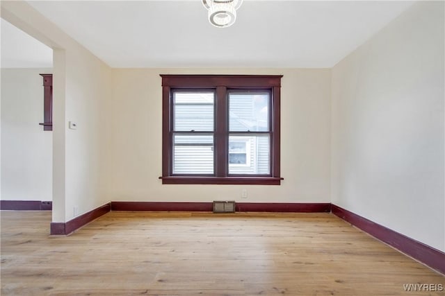 153 Hinman Ave, Buffalo, NY 14216 - spare room featuring baseboards and light wood-style floors