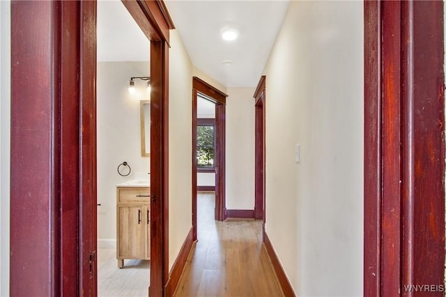 153 Hinman Ave, Buffalo, NY 14216 - corridor with light wood-style flooring and baseboards