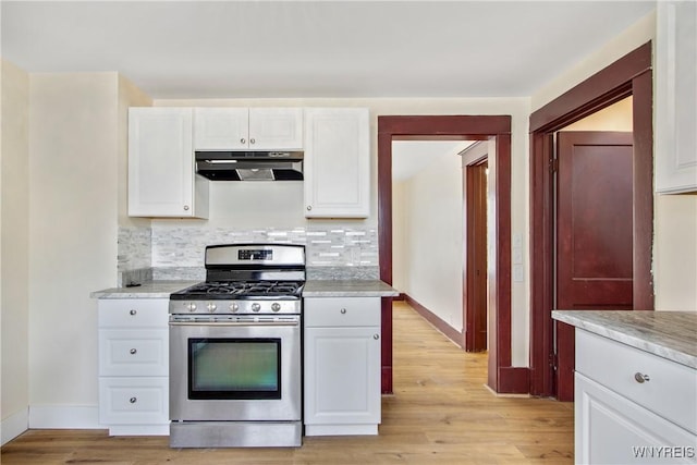 153 Hinman Ave, Buffalo, NY 14216 - kitchen with extractor fan, stainless steel gas range oven, light wood finished floors, and decorative backsplash