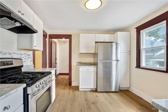 153 Hinman Ave, Buffalo, NY 14216 - kitchen featuring stainless steel appliances, under cabinet range hood, light wood-style flooring, and tasteful backsplash