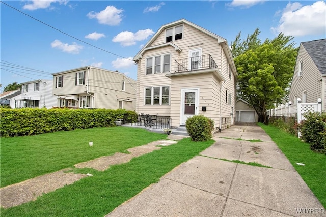 153 Hinman Ave, Buffalo, NY 14216 - rear view of property with a balcony, a garage, and driveway