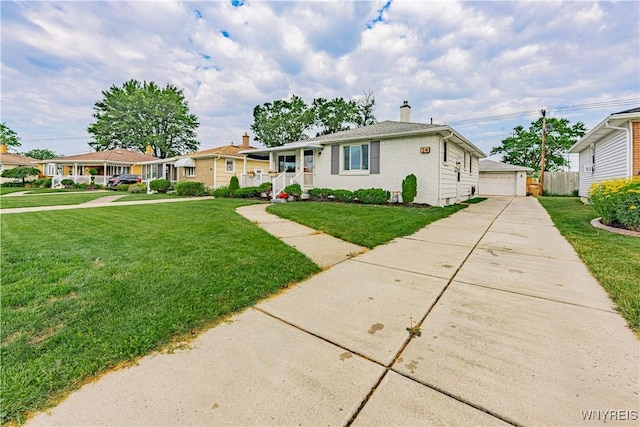 24 Ceil Dr, Cheektowaga, NY 14227 - view of front of home featuring a chimney, a front yard, a garage, covered porch, and an outdoor structure