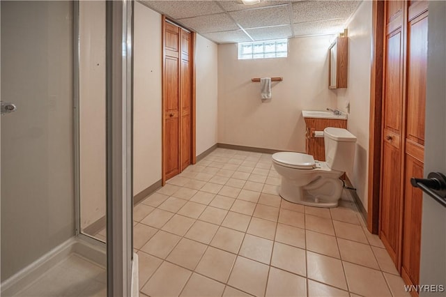 24 Ceil Dr, Cheektowaga, NY 14227 - bathroom with vanity, a stall shower, a drop ceiling, tile patterned flooring, and a closet