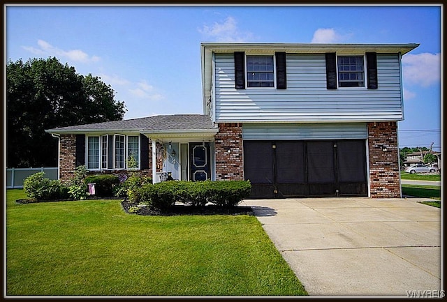 4 Windtree Ln, West Seneca, NY 14224 - view of front facade featuring brick siding, a garage, and concrete driveway