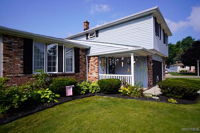 4 Windtree Ln, West Seneca, NY 14224 - view of front of home with brick siding, a porch, a front lawn, and a chimney