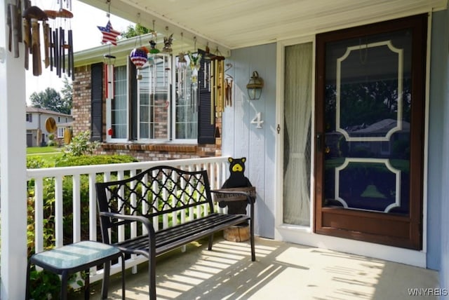 4 Windtree Ln, West Seneca, NY 14224 - view of exterior entry featuring covered porch and brick siding