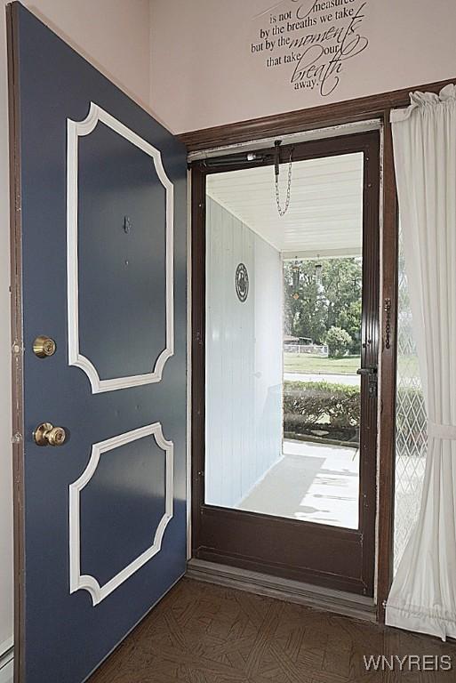 4 Windtree Ln, West Seneca, NY 14224 - doorway to property with covered porch and a baseboard heating unit