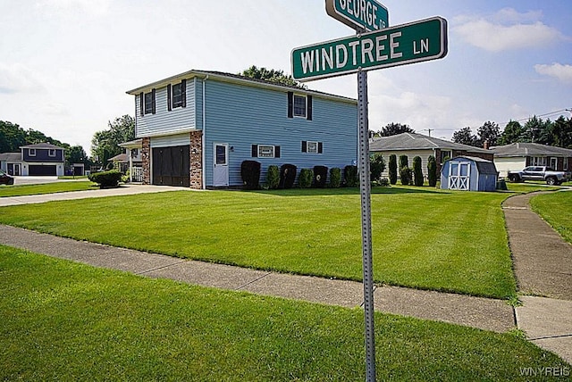 4 Windtree Ln, West Seneca, NY 14224 - view of front facade featuring a storage unit, a garage, a front lawn, and driveway
