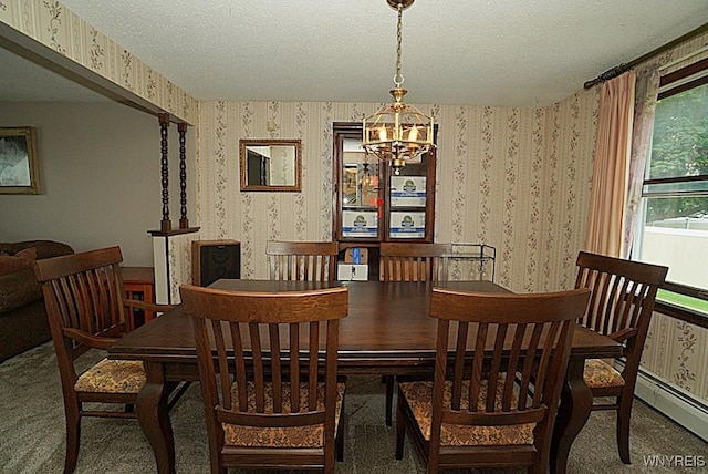 4 Windtree Ln, West Seneca, NY 14224 - dining area with wallpapered walls, a chandelier, carpet flooring, a baseboard heating unit, and a textured ceiling