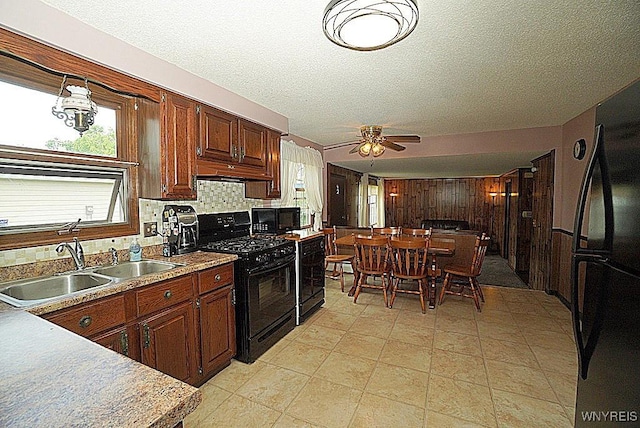 4 Windtree Ln, West Seneca, NY 14224 - kitchen with black appliances, ceiling fan, backsplash, and light countertops