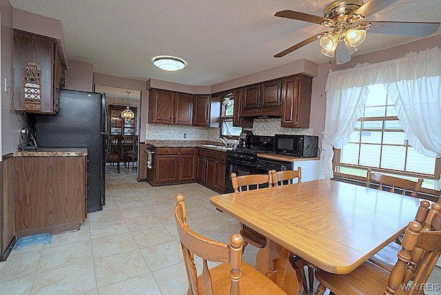 4 Windtree Ln, West Seneca, NY 14224 - kitchen featuring black appliances, ceiling fan, backsplash, dark brown cabinets, and a textured ceiling
