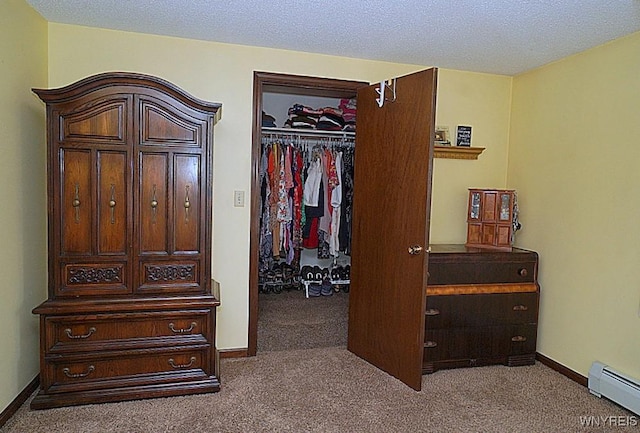 4 Windtree Ln, West Seneca, NY 14224 - bedroom with a baseboard radiator, carpet flooring, and a walk in closet