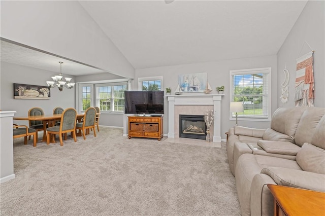 65 Sotheby Dr, Greece, NY 14626 - living area featuring a chandelier, light carpet, plenty of natural light, and vaulted ceiling