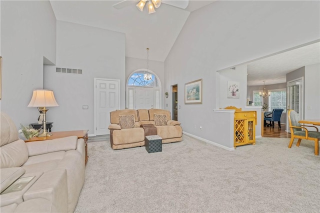 65 Sotheby Dr, Greece, NY 14626 - living area with a chandelier, high vaulted ceiling, plenty of natural light, a ceiling fan, and carpet floors