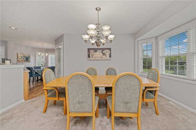 65 Sotheby Dr, Greece, NY 14626 - dining room with a chandelier and light carpet