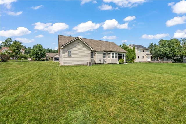 65 Sotheby Dr, Greece, NY 14626 - rear view of house featuring a yard