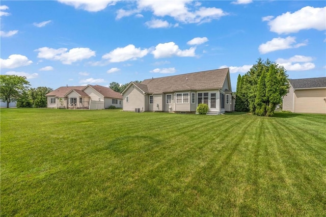 65 Sotheby Dr, Greece, NY 14626 - rear view of property with a yard and entry steps