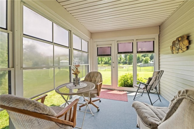 65 Sotheby Dr, Greece, NY 14626 - sunroom / solarium with carpet flooring and wood walls