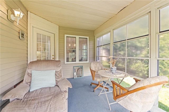 65 Sotheby Dr, Greece, NY 14626 - sunroom / solarium featuring wooden walls and carpet flooring