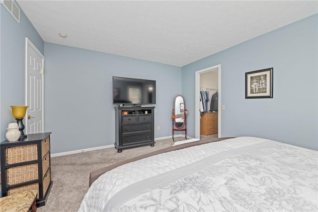 65 Sotheby Dr, Greece, NY 14626 - carpeted bedroom with a spacious closet and a textured ceiling