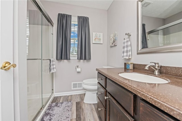 65 Sotheby Dr, Greece, NY 14626 - full bath featuring vanity, a stall shower, and wood finished floors