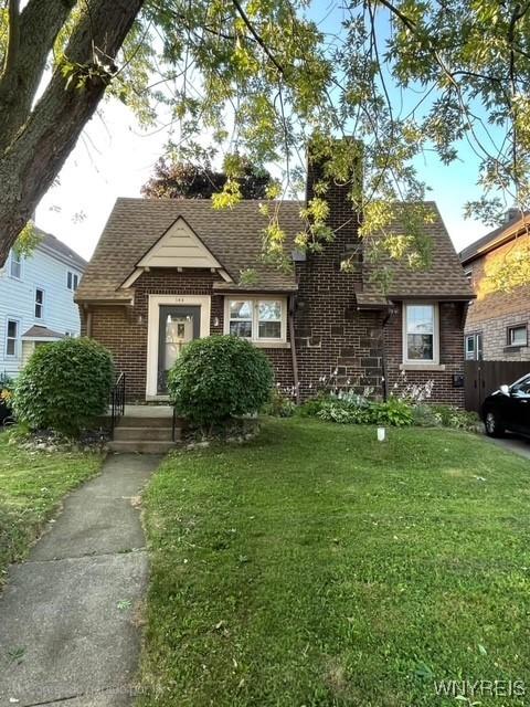 144 Culver Rd, Buffalo, NY 14220 - tudor home featuring brick siding and roof with shingles