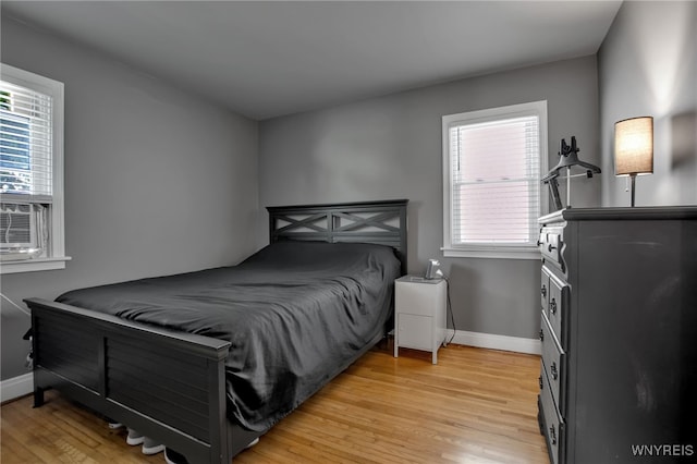 1871 Eggert Rd, Amherst, NY 14226 - bedroom with light wood-type flooring and multiple windows