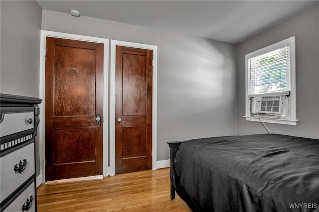 1871 Eggert Rd, Amherst, NY 14226 - bedroom featuring light wood-style flooring and cooling unit