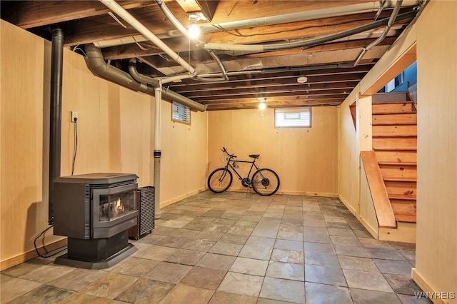 1871 Eggert Rd, Amherst, NY 14226 - basement with a wood stove, stairs, and stone finish flooring