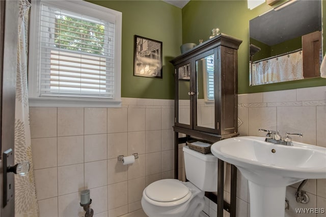 1871 Eggert Rd, Amherst, NY 14226 - bathroom featuring tile walls and wainscoting