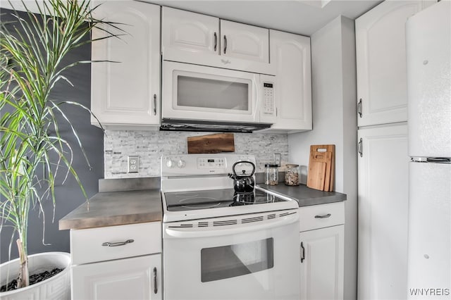 1871 Eggert Rd, Amherst, NY 14226 - kitchen with white appliances, white cabinets, and backsplash