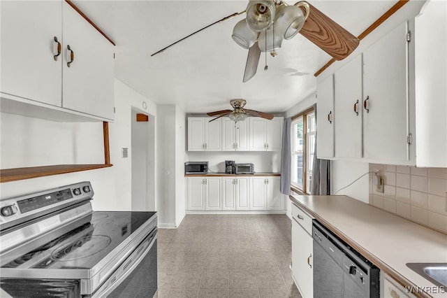302 Midland Ave, Tonawanda, NY 14223 - kitchen featuring stainless steel appliances, ceiling fan, white cabinets, and decorative backsplash
