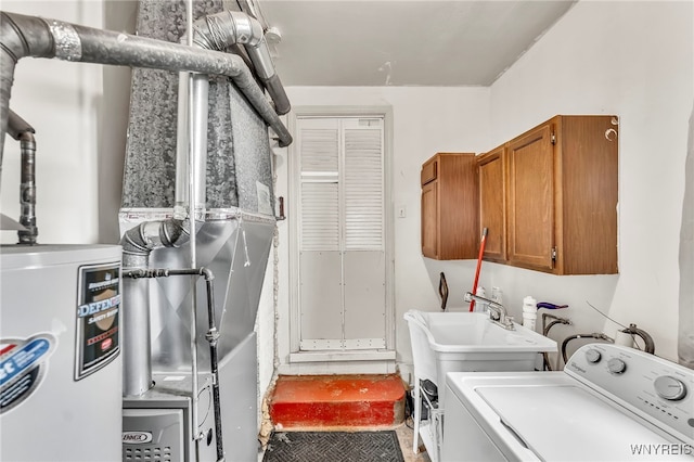 302 Midland Ave, Tonawanda, NY 14223 - laundry room featuring washer / clothes dryer, cabinet space, and water heater