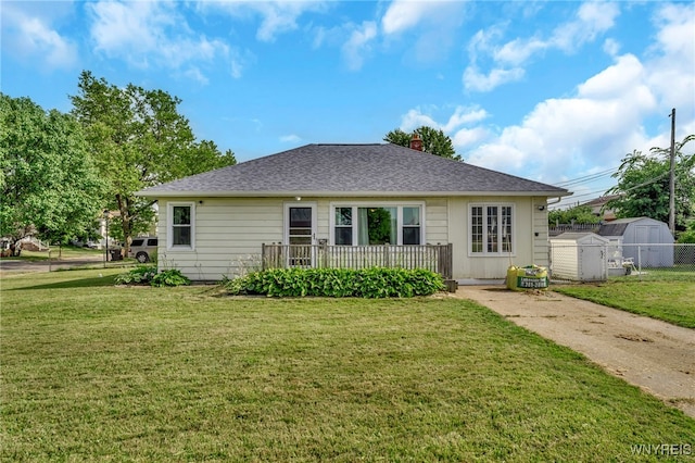 302 Midland Ave, Tonawanda, NY 14223 - rear view of house featuring a storage shed, a chimney, and roof with shingles
