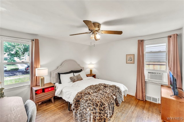 302 Midland Ave, Tonawanda, NY 14223 - bedroom featuring wood finished floors, cooling unit, and a ceiling fan