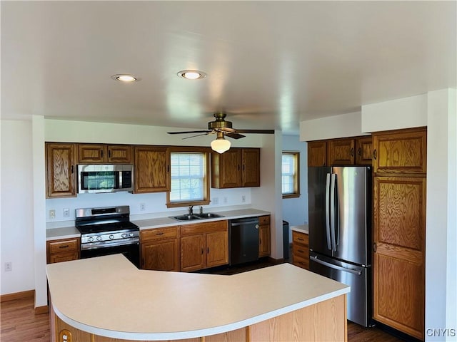 3370 Hicks Rd, Scipio, NY 13118 - kitchen with stainless steel appliances, light countertops, and a ceiling fan