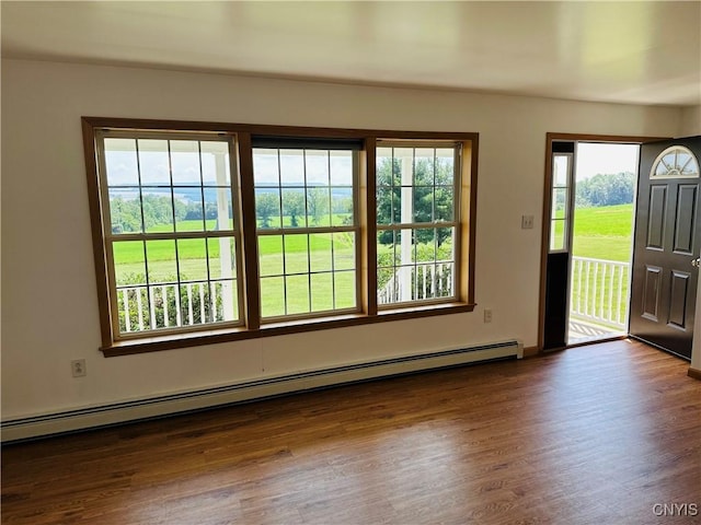 3370 Hicks Rd, Scipio, NY 13118 - foyer entrance with baseboard heating and dark wood-type flooring
