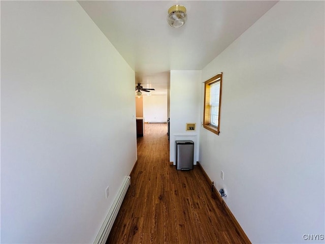 3370 Hicks Rd, Scipio, NY 13118 - corridor featuring a baseboard heating unit and dark wood-style floors