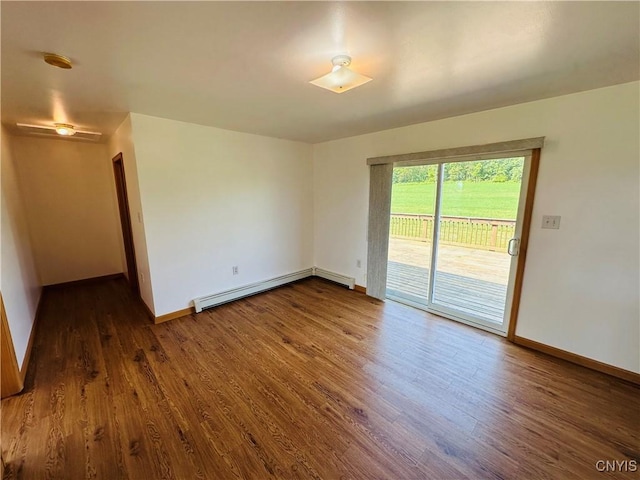 3370 Hicks Rd, Scipio, NY 13118 - unfurnished room with a baseboard heating unit, dark wood-type flooring, and a smoke detector