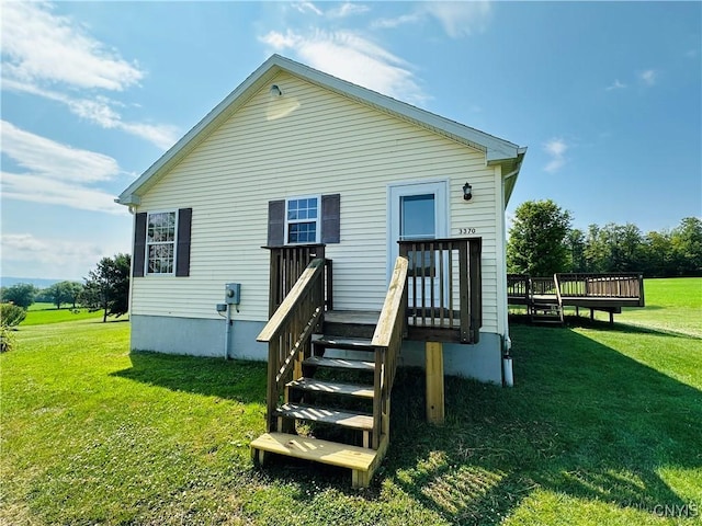 3370 Hicks Rd, Scipio, NY 13118 - rear view of house with a lawn and a wooden deck