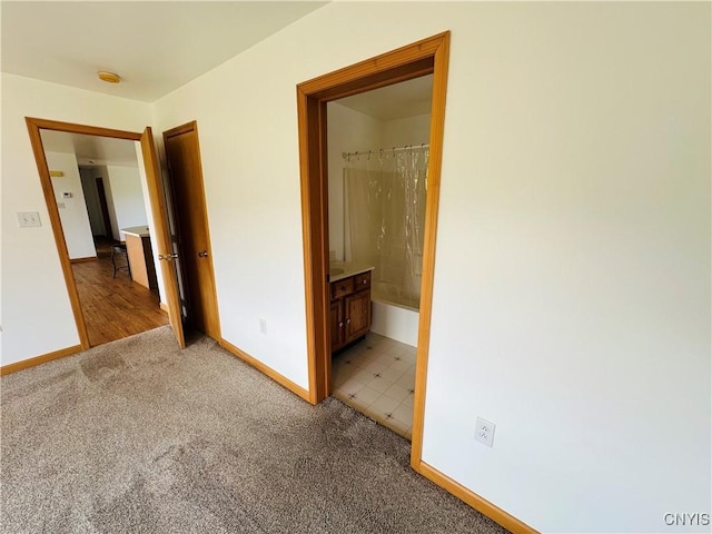 3370 Hicks Rd, Scipio, NY 13118 - unfurnished bedroom with light colored carpet and connected bathroom