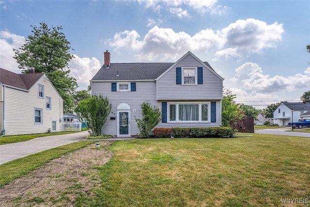 165 Kelvin Dr, Tonawanda, NY 14223 - view of front facade featuring a chimney and a front yard