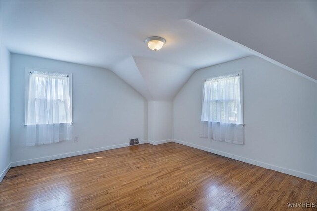 165 Kelvin Dr, Tonawanda, NY 14223 - bonus room with plenty of natural light, wood finished floors, and lofted ceiling